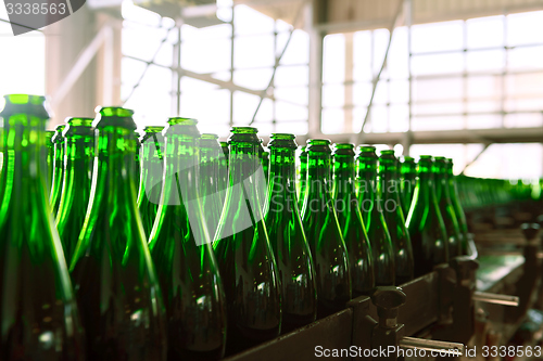 Image of Many bottles on conveyor belt