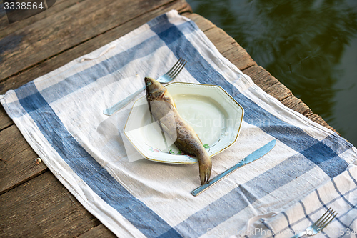 Image of Wooden deck with fish on it