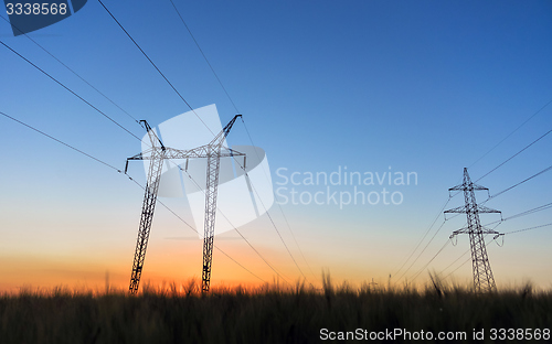 Image of Large transmission towers at blue hour 