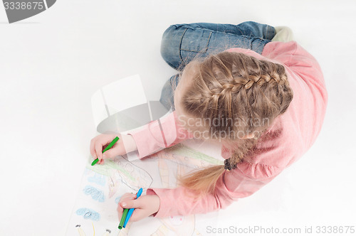 Image of View from above to drawing little girl