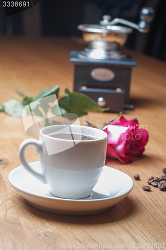 Image of Vintage coffee mill, cup and rose