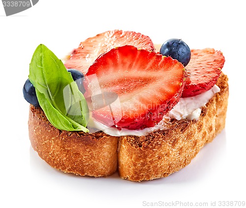 Image of toasted bread slice with cream cheese and strawberries