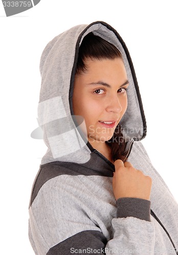 Image of Pretty girl in gray hoodie in profile.