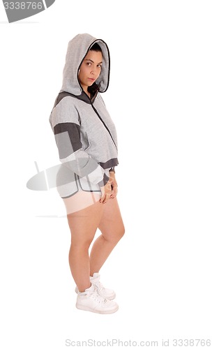 Image of Standing woman in gray hoodie and shorts.