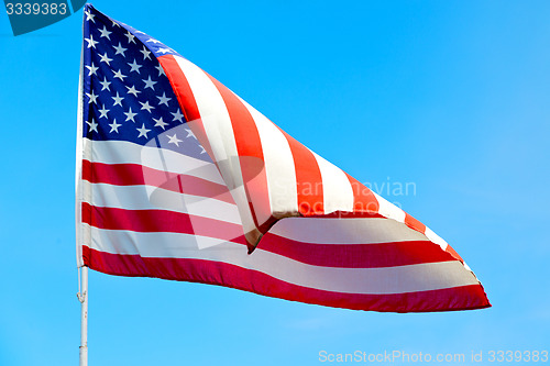 Image of usa waving flag in the blue sky 