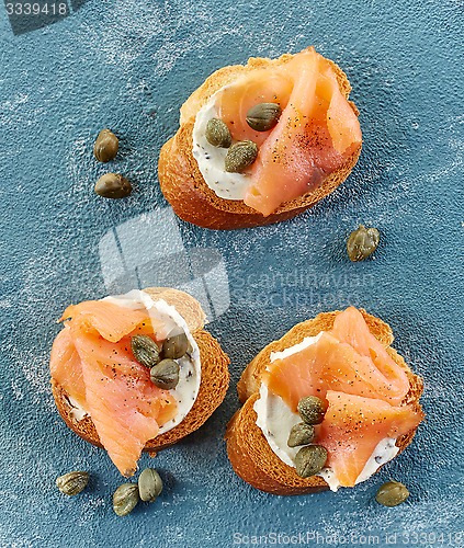 Image of toasted bread slices with cream cheese and smoked salmon