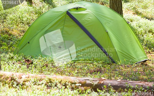 Image of camping outdoor with  tent in woods in summer 