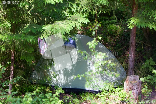 Image of camping outdoor with  tent in woods in summer 