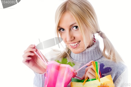 Image of Pretty smiling girl with shopping bags