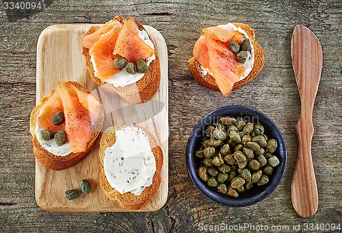 Image of toasted bread slices with cream cheese and smoked salmon