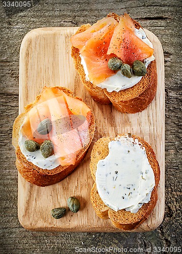 Image of toasted bread slices with cream cheese and smoked salmon