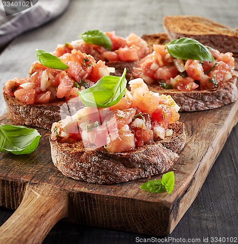 Image of toasted bread with chopped tomatoes