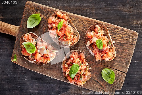 Image of toasted bread with chopped tomatoes