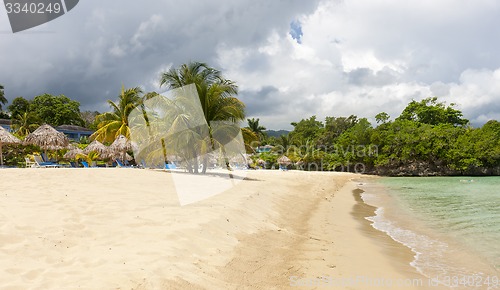 Image of Beach on tropical island. Clear blue water and sky 