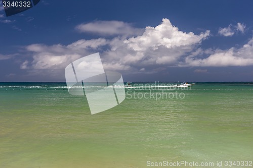 Image of Beach on tropical island. Clear blue water and sky 