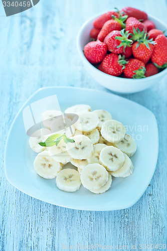 Image of banana with strawberry