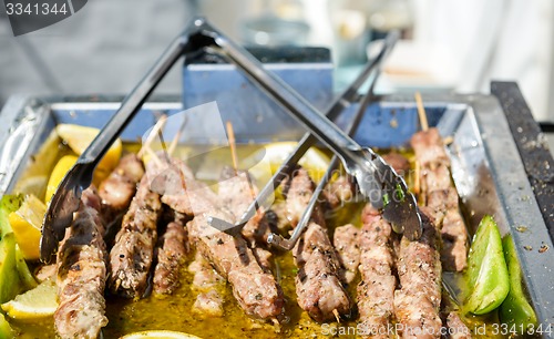 Image of Juicy roasted kebabs on the metal tray