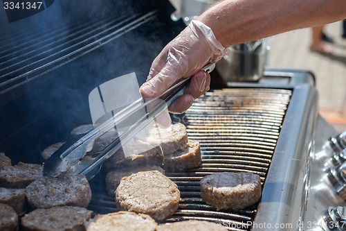 Image of cooking steaks on a hot grill