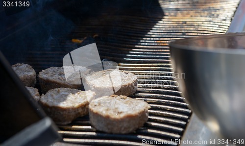 Image of cooking steaks on a hot grill