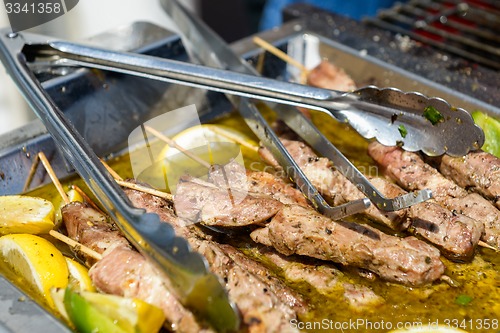 Image of Juicy roasted kebabs on the metal tray