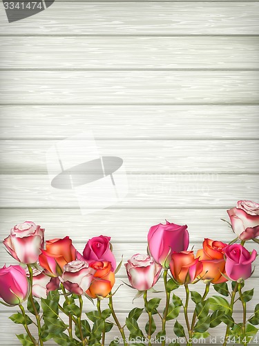 Image of Roses on wooden background table. EPS 10
