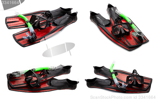 Image of Set of red swim fins, mask and snorkel for diving on white backg