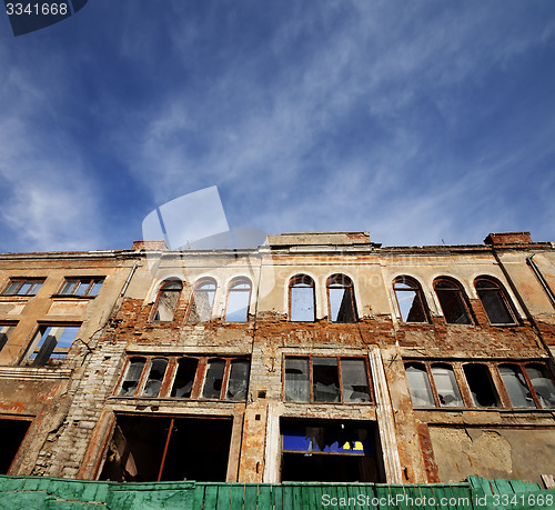 Image of Facade of old destroyed house. Wide-angle view.