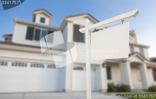 Image of Blank Real Estate Sign in Front of New House 