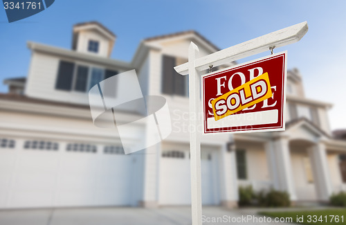 Image of Sold Home For Sale Sign in Front of New House