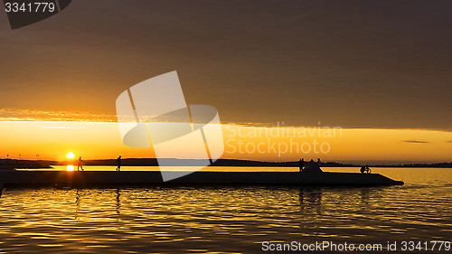 Image of Summer afterglow sunset sky on city quay