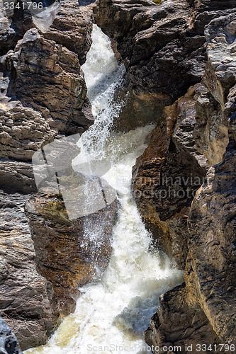 Image of Waterfall Flowing Between the Lava Stones