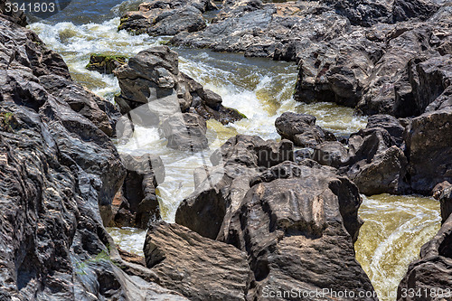 Image of Waterfall Flowing Between the Lava Stones