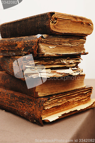 Image of stack of old tattered books