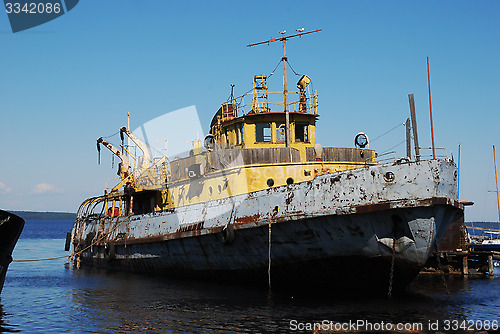 Image of old rusty ship in the port
