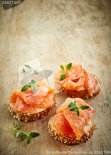 Image of bread with fresh salmon fillet