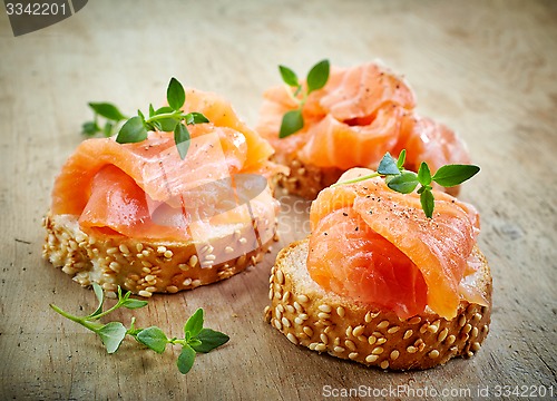 Image of bread with fresh salmon fillet