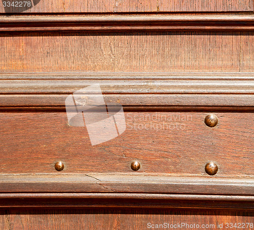 Image of door    in italy old ancian wood and traditional  texture nail