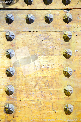 Image of metal nail dirty  paint in the brown    rusty  yellow  