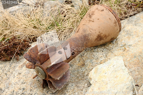 Image of rusty bomb shell case