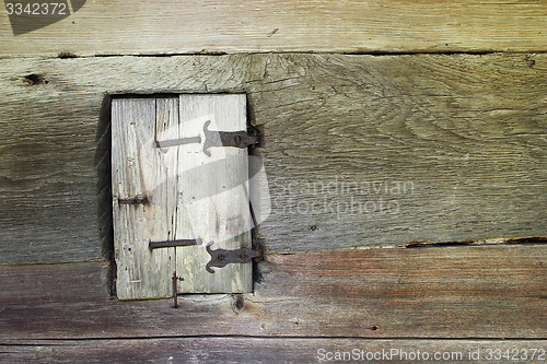 Image of ancient blind on window