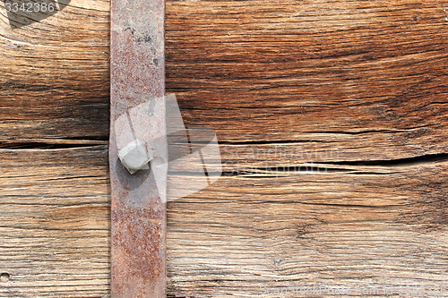Image of metallic mount on oak beam