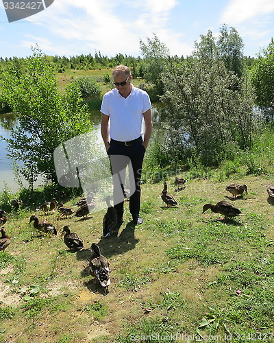Image of Man with ducks