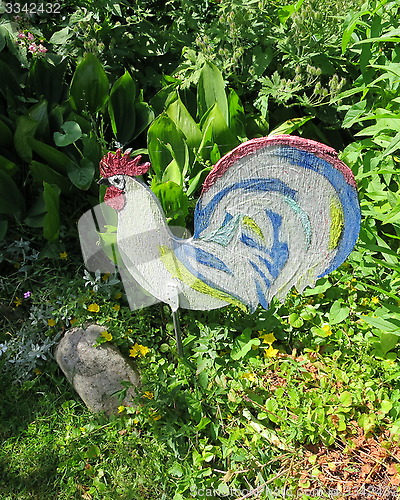 Image of Cock decoration in garden