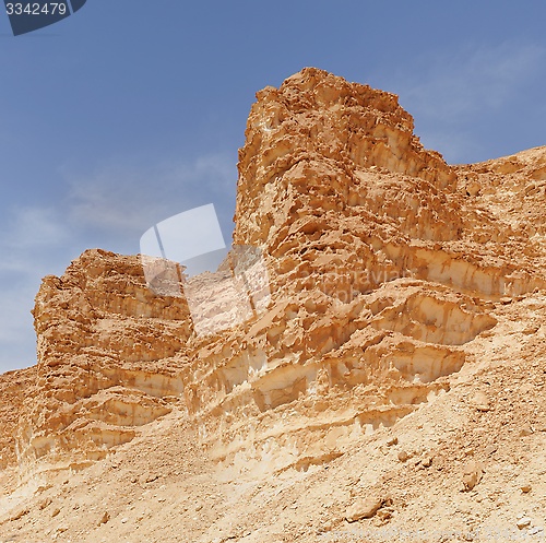 Image of Scenic weathered orange  rocks in stone desert