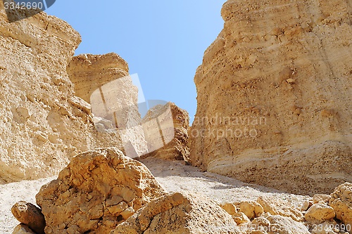 Image of Scenic weathered orange  rocks in stone desert