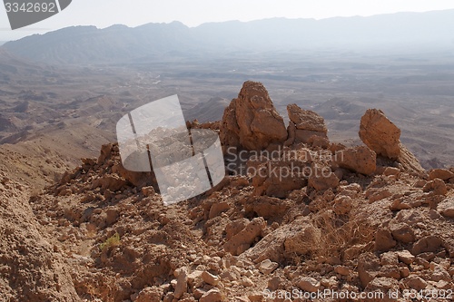 Image of Jagged  rocks at the rim of desert canyon in the Small Crater (Makhtesh Katan) in Negev desert, Israel