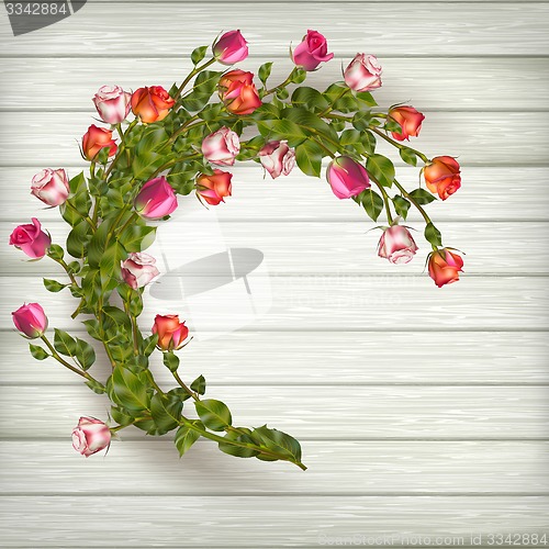 Image of Roses wreath on wooden background. EPS 10