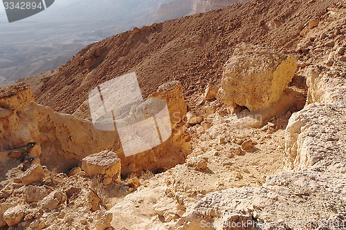 Image of Scenic orange rocks in desert canyon (Small Crater, or Makhtesh Katan in Negev desert, Israel)