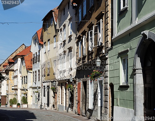 Image of Old street in European town converging in perspective