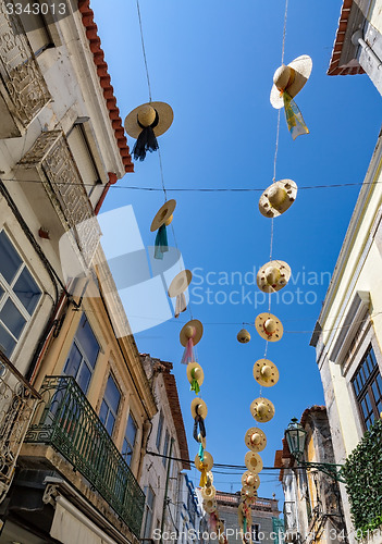 Image of City Streets Decorated with Straw Hats